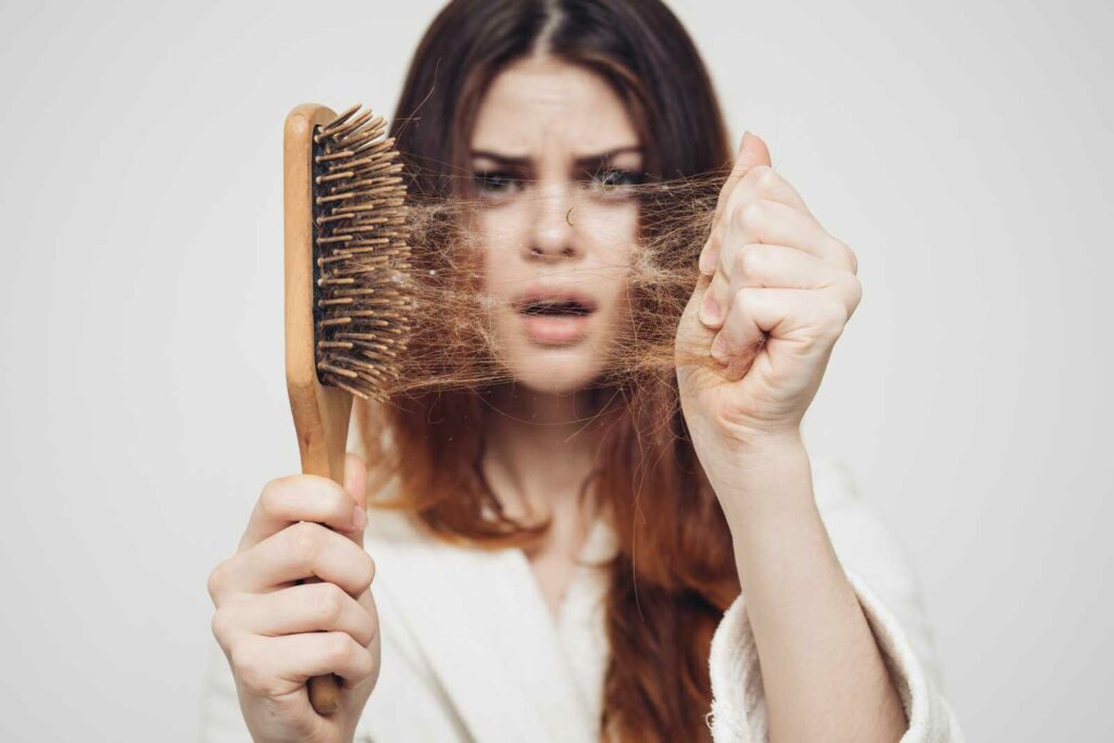 girl with a comb and problem hair