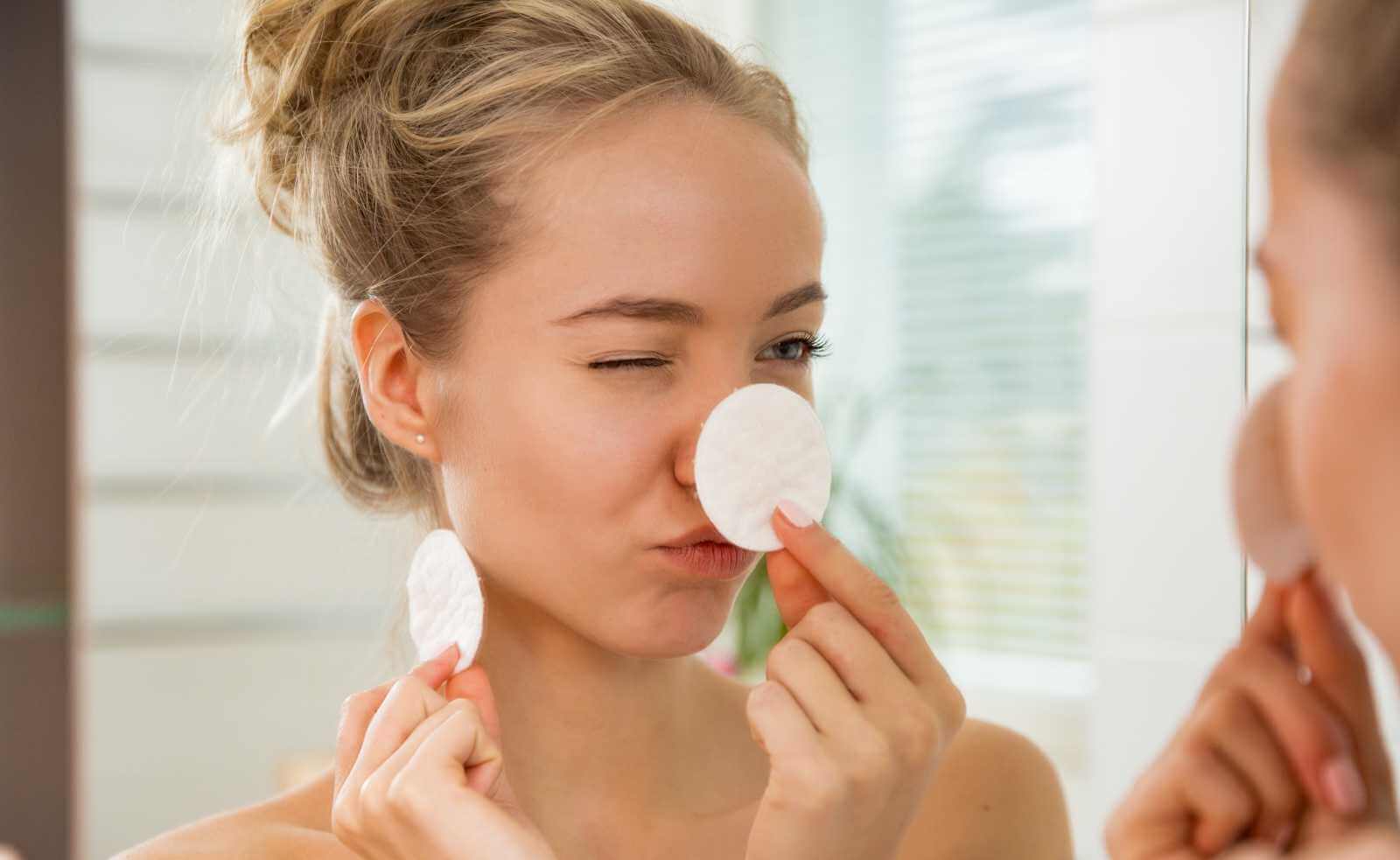 teen cleaning face