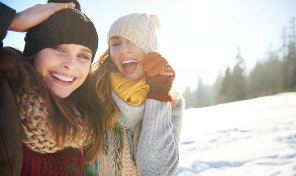 beauty women smiles at snow