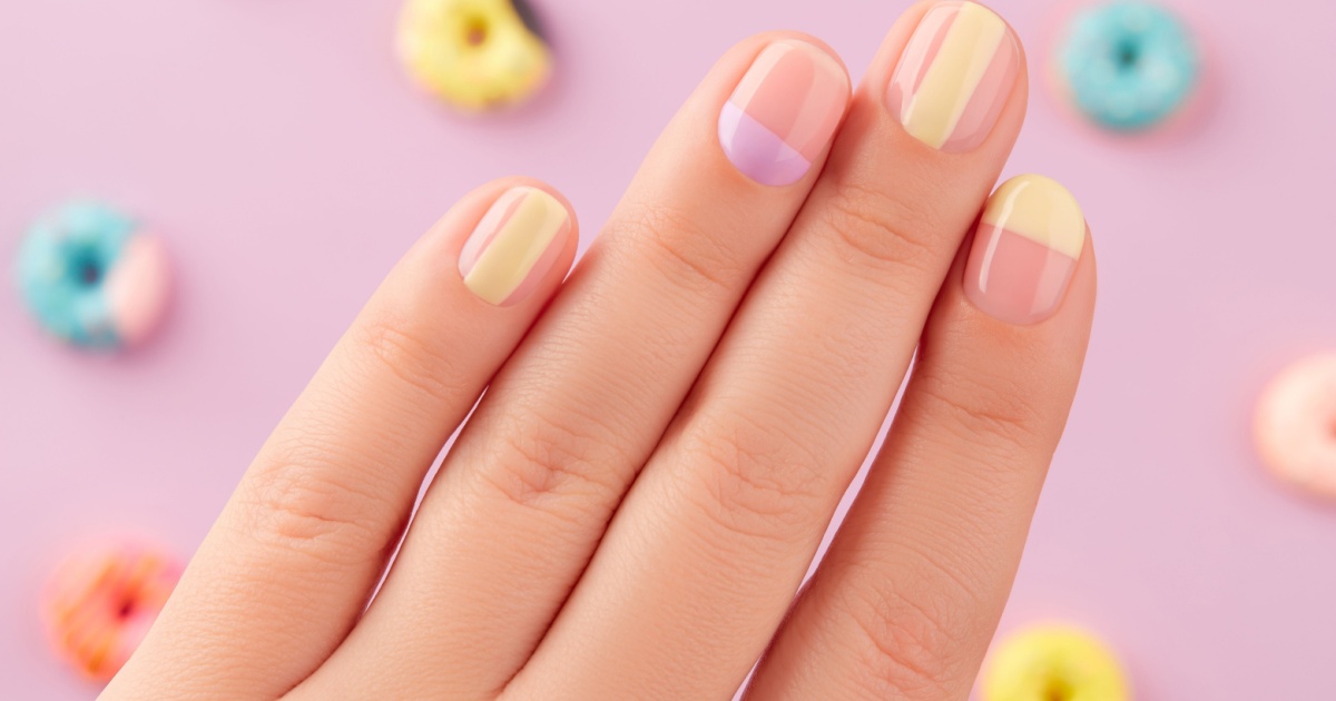 Beautiful yellow lavender manicure on creative background