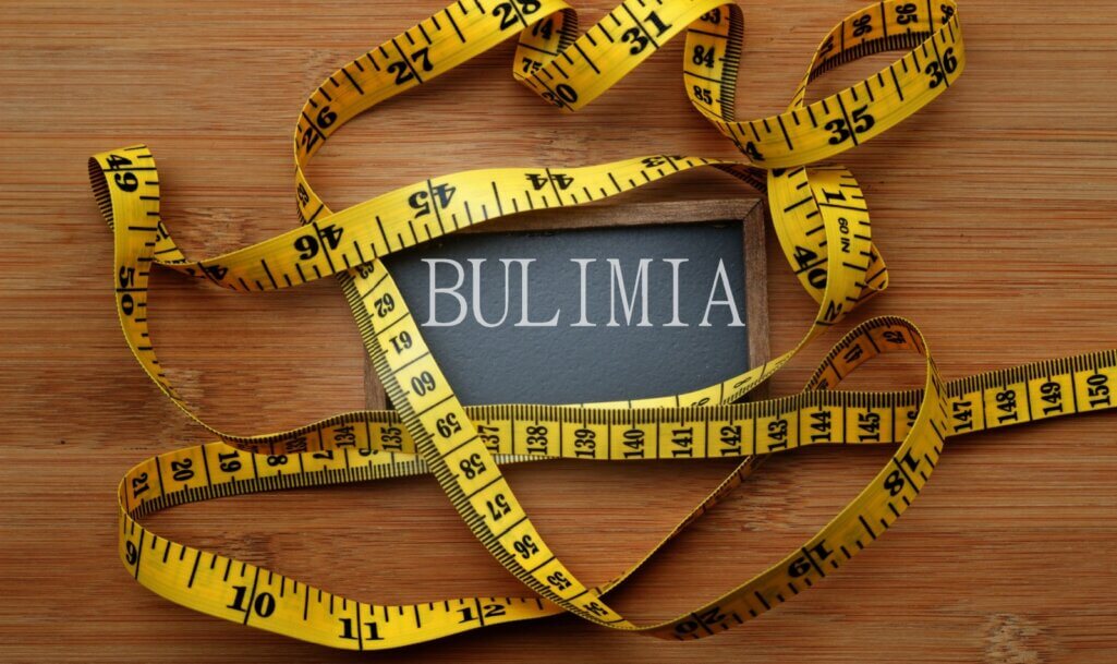 Word Bulimia written on chalkboard. Conceptual with vignette effect to emphasize the issue of Bulimia.