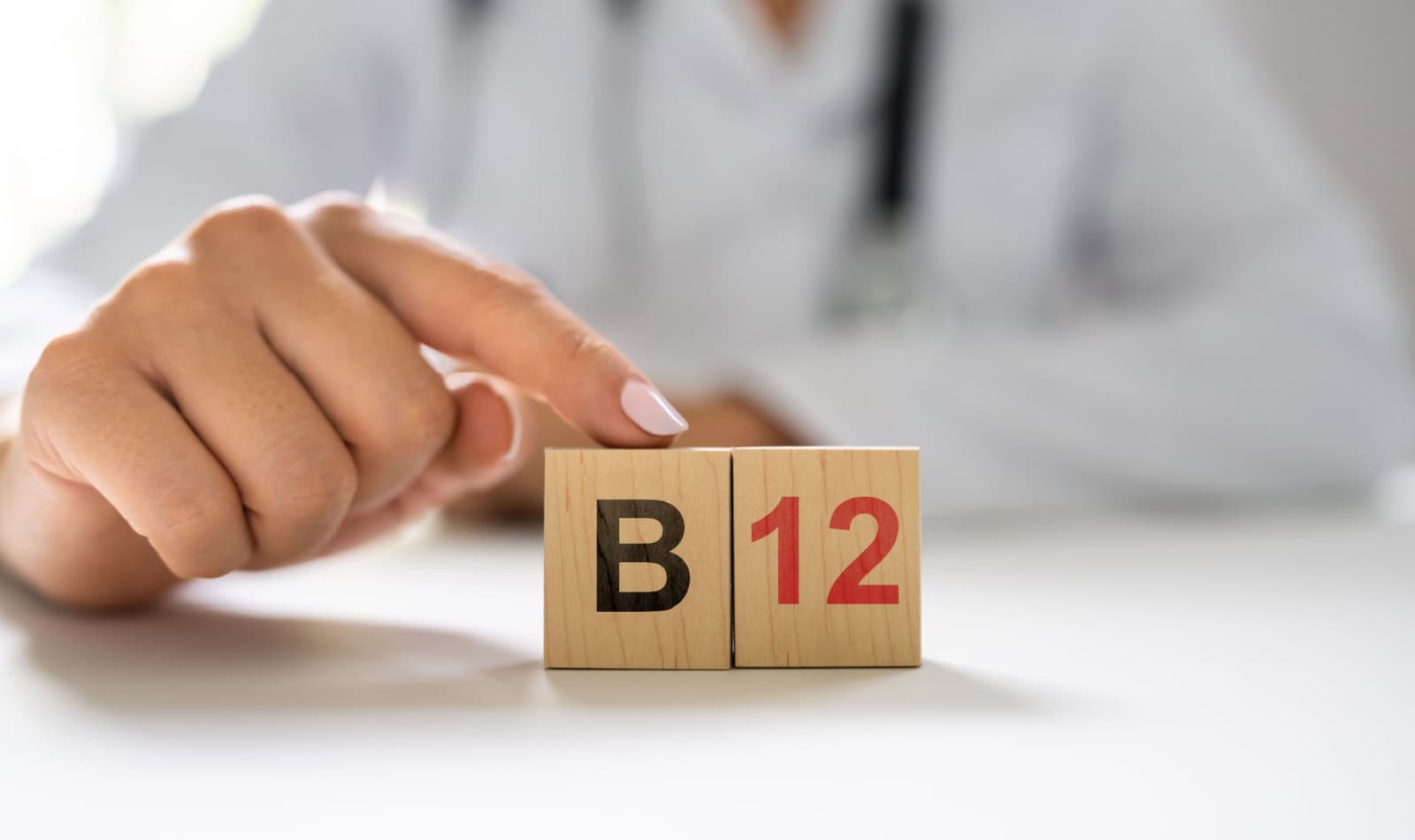 Vitamin B12. Medical Doctor Hand In Hospital
